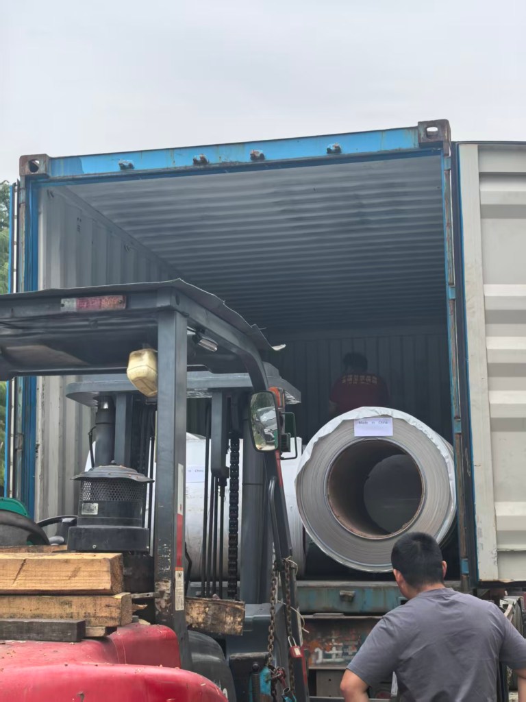 Stainless steel products being loaded for shipment after production and inspection.
