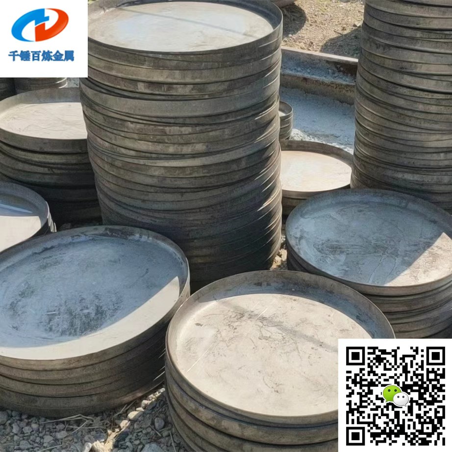 Stacks of stainless steel flat heads in different diameters prepared for pressure vessel, tank and fabricated equipment applications.