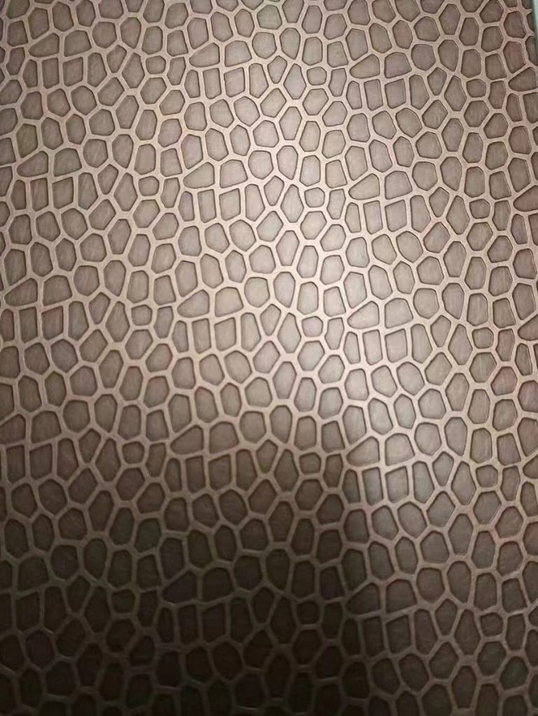 Bronze and antique copper stainless steel sheet with a repeating honeycomb pattern and softly brushed metallic surface for decorative stainless steel panels and interior applications.