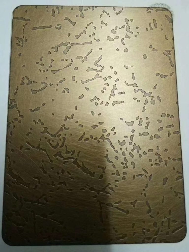 Antique brass and bronze-toned stainless steel sheet with irregular mottled markings and a distressed metallic texture for decorative and architectural surface applications.