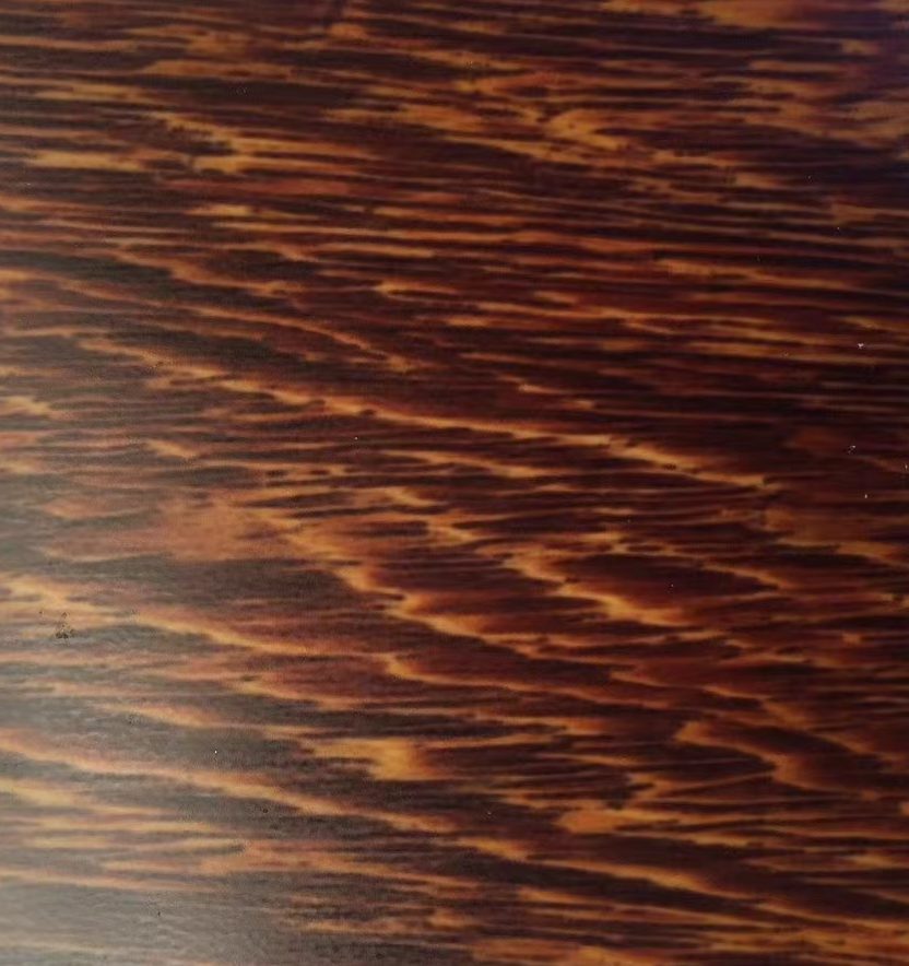 Dark brown and copper stainless steel sheet with layered horizontal wood-grain patterns and warm metallic highlights for decorative panels and custom surface finishing.