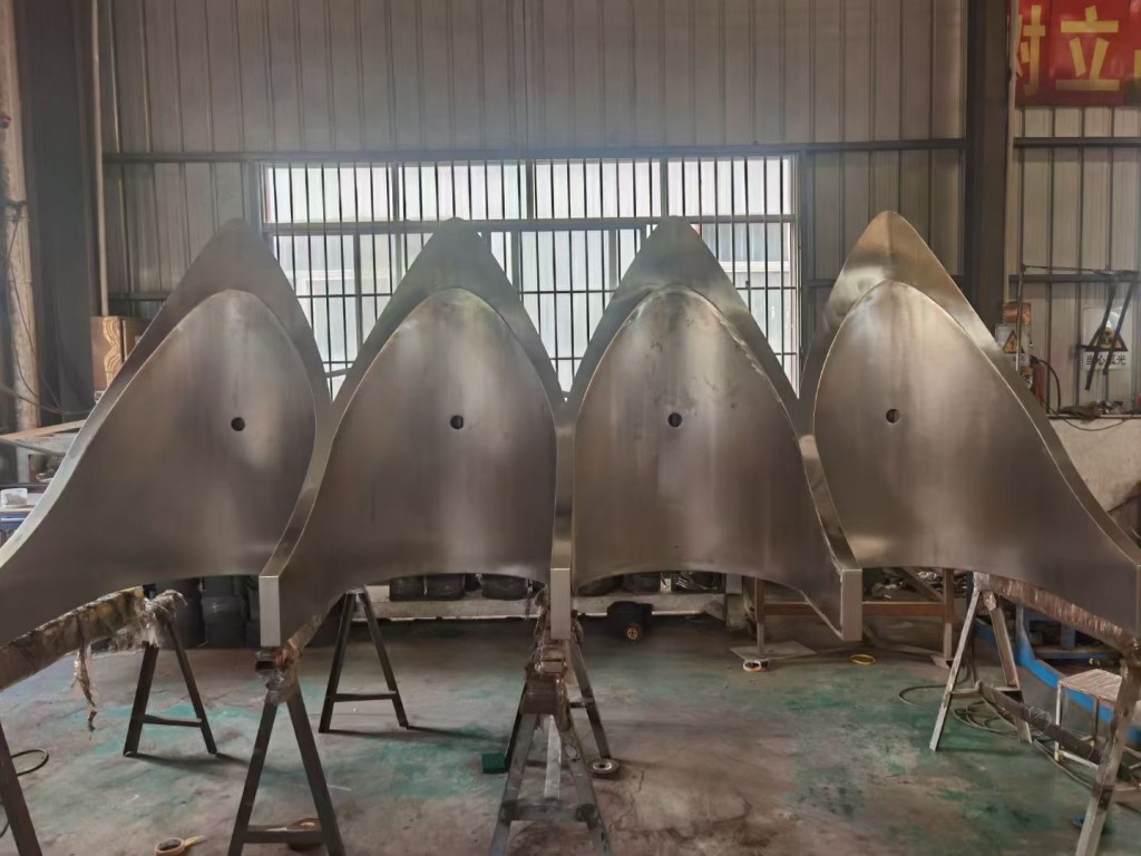 Custom fabricated stainless steel curved structures produced from project drawings and custom dimensions for architectural and industrial applications.