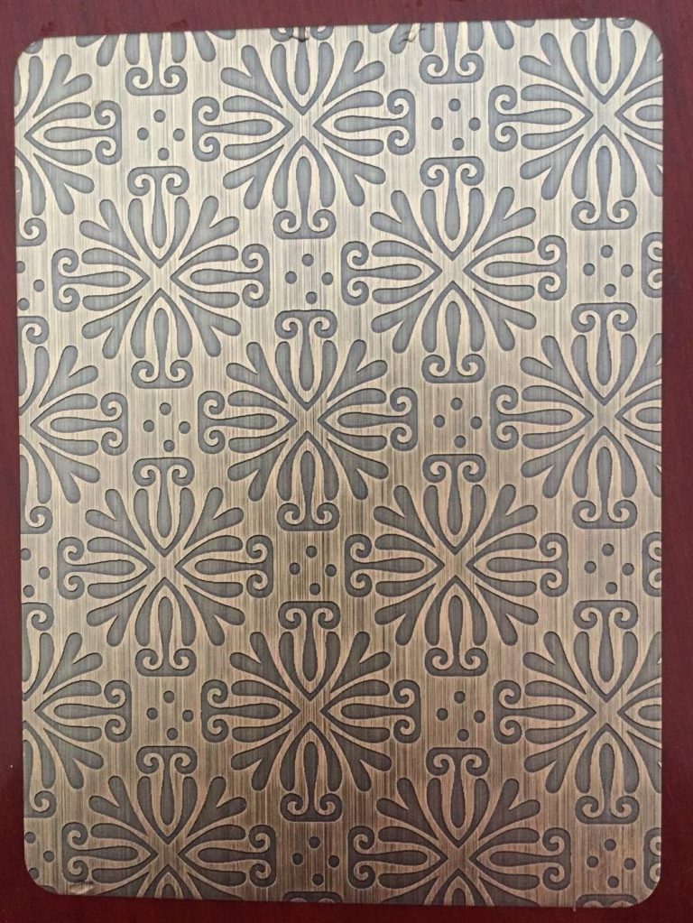 Antique copper stainless steel sheet with repeating floral and scroll patterns, combining a brushed metallic background with decorative etched details for interior and architectural surface applications.