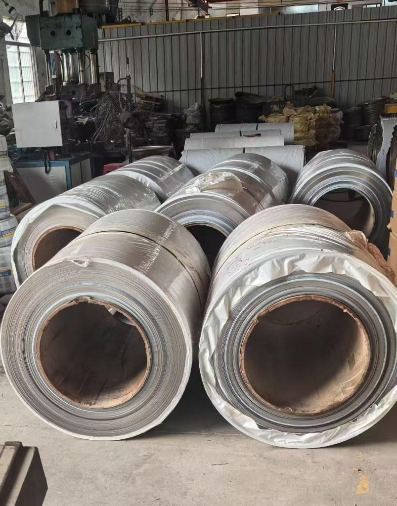 Stainless steel coils packaged for storage and transportation, prepared for fabrication and project-specific processing requirements.