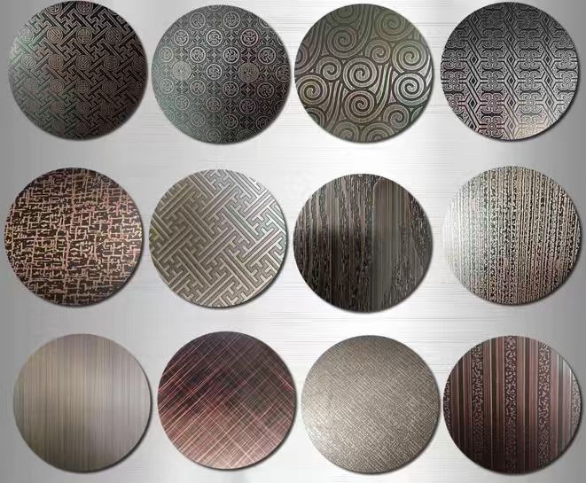 Colored stainless steel samples with decorative patterns and surface finishes