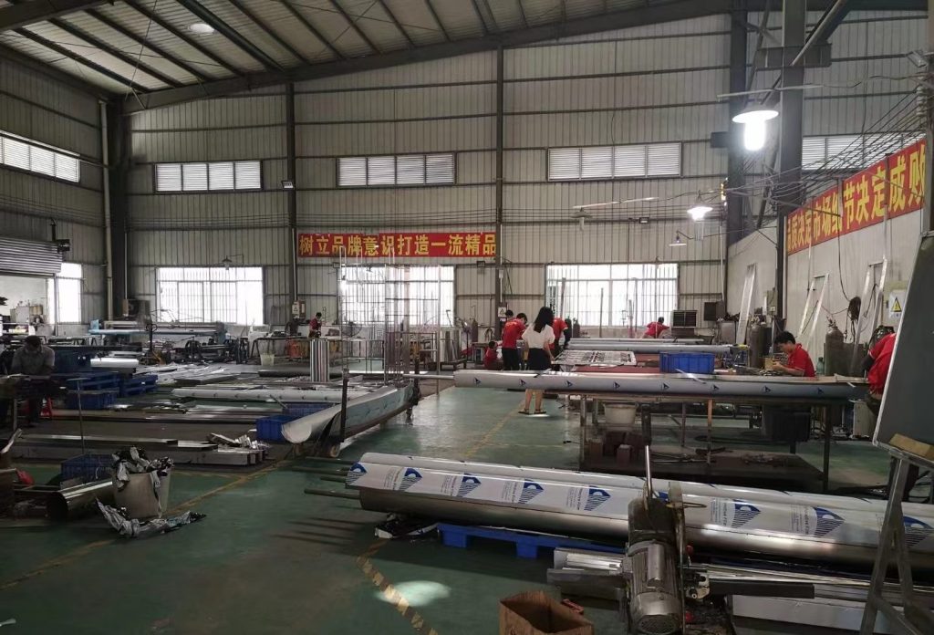 Stainless steel processing workshop and fabrication equipment for reviewing custom project and production requirements.