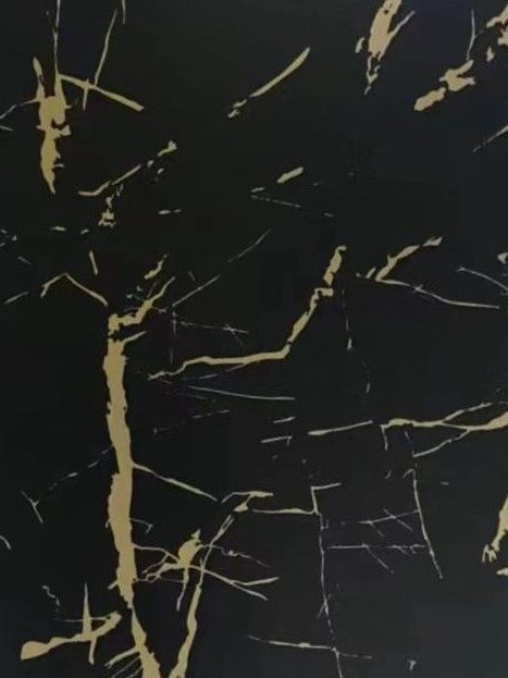 Black stainless steel sheet with irregular gold crackle and vein patterns resembling fractured stone, designed as a decorative surface finish for architectural and interior applications.