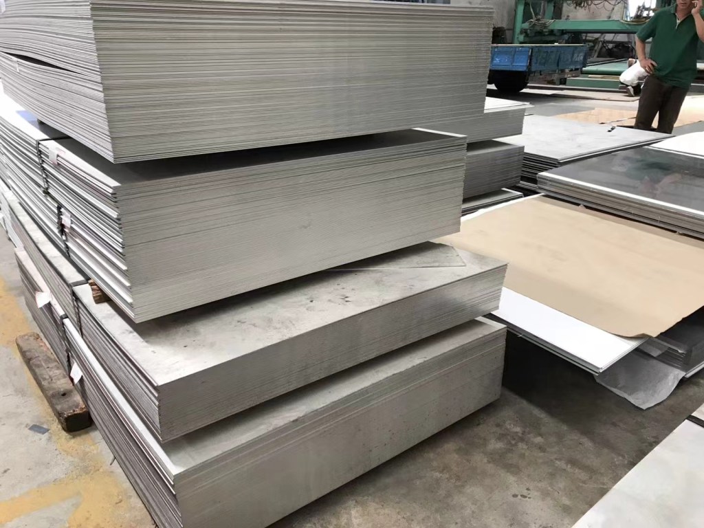 Stacked stainless steel sheets available for custom material and size requirements