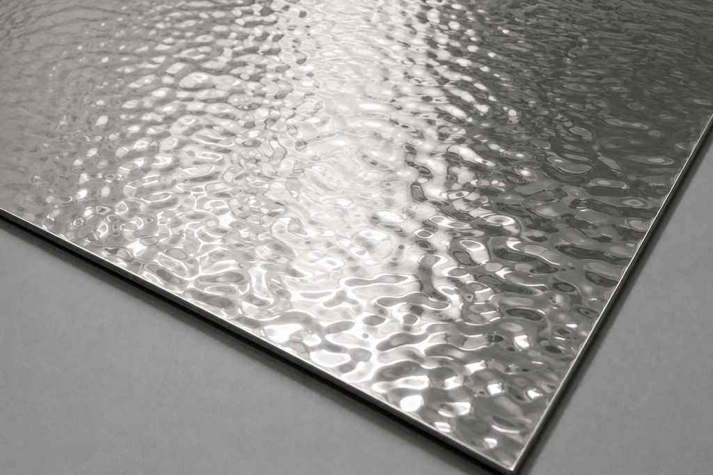 Water ripple stainless steel sheet with a textured wave pattern and reflective decorative surface. A textured stainless steel surface with flowing, wave-like patterns that create changing reflections under different lighting conditions.
