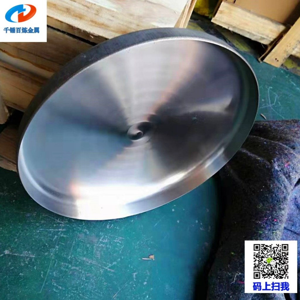 Formed stainless steel flat head with a smooth circular surface for custom tank and pressure vessel fabrication.