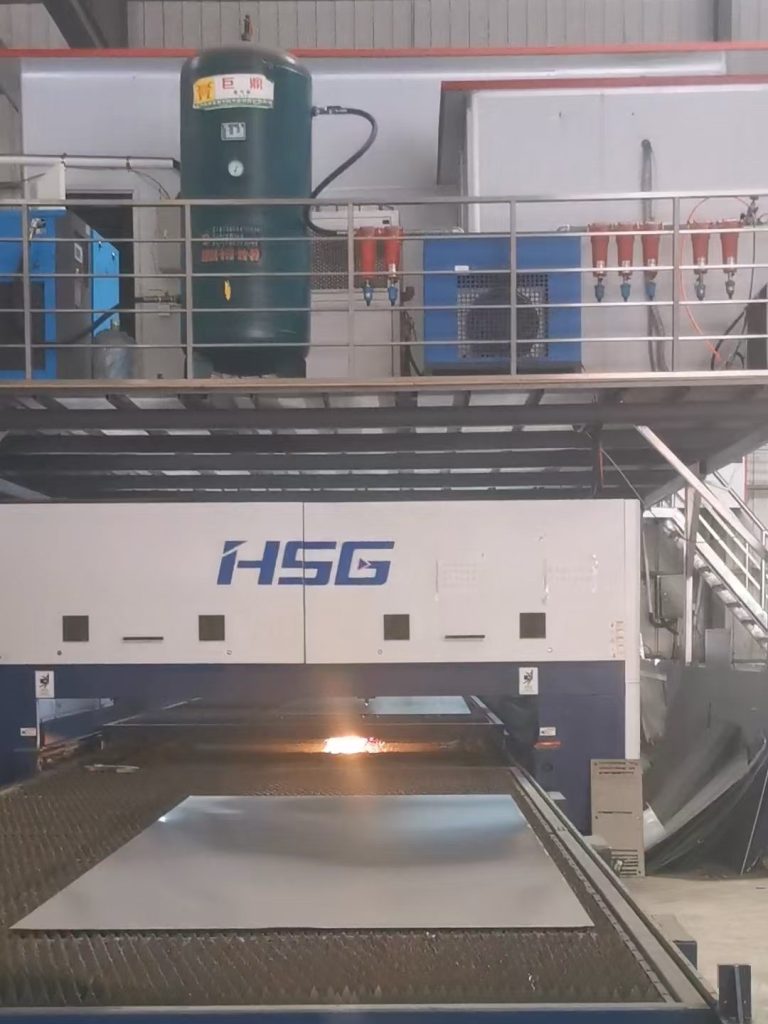 Laser cutting machine processing stainless steel sheets and custom metal components for precision fabrication.