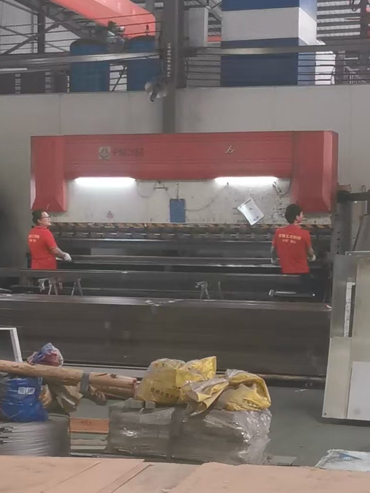 Industrial press brake bending stainless steel sheets and fabricated components to custom dimensions and profiles.